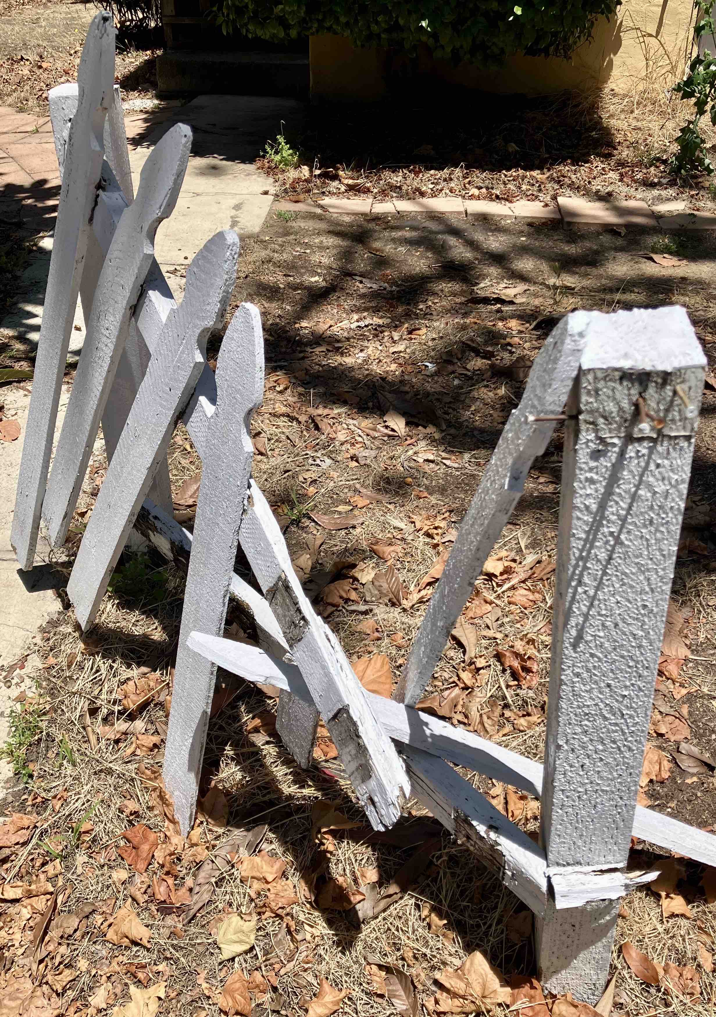 Broken white picket fence