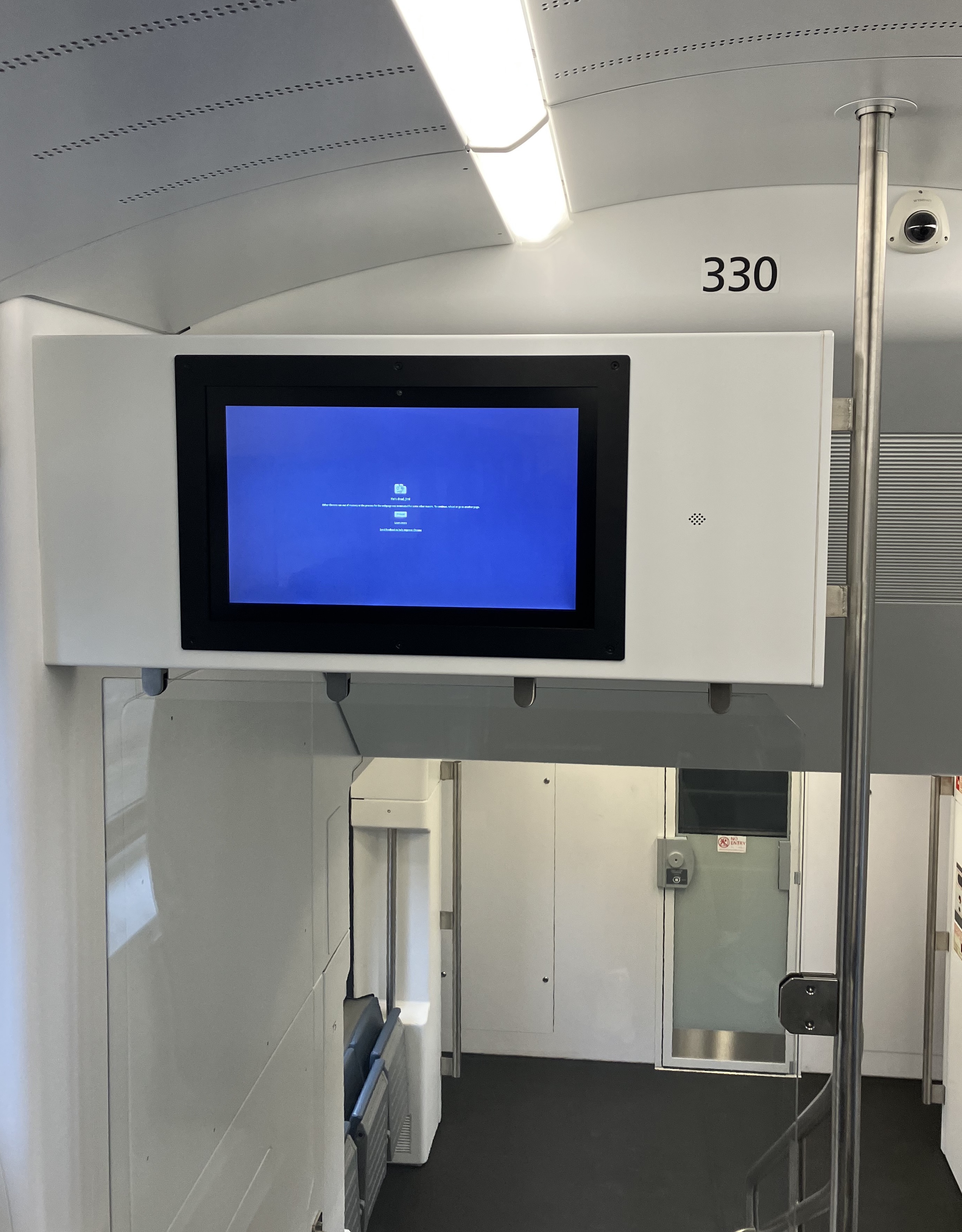 The passenger information screen in brand-new Caltrain Stadler electric train car 330 shows a blue error screen